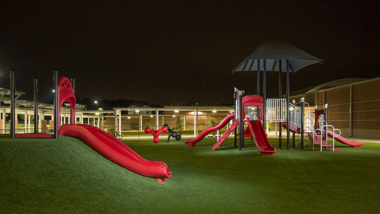 Nighttime artificial turf playground by Southwest Greens of Michigan